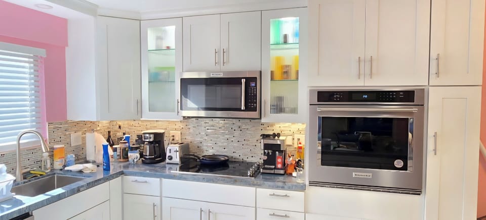 Brand New Kitchen, cabinets, island, countertops, oven, stove top, microwave.