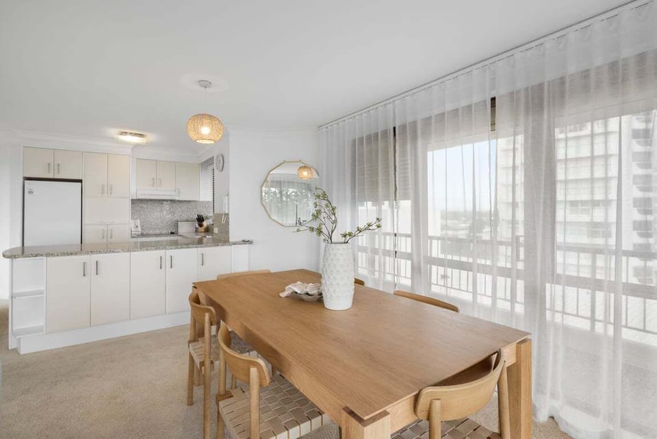 Gather around the dining table for relaxed coastal dining.