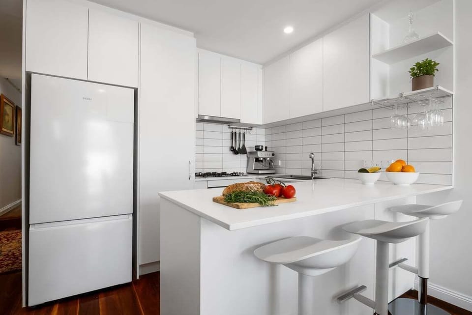 KITCHEN: Enjoy a drink at the kitchen bench or a coffee from the espresso machine.