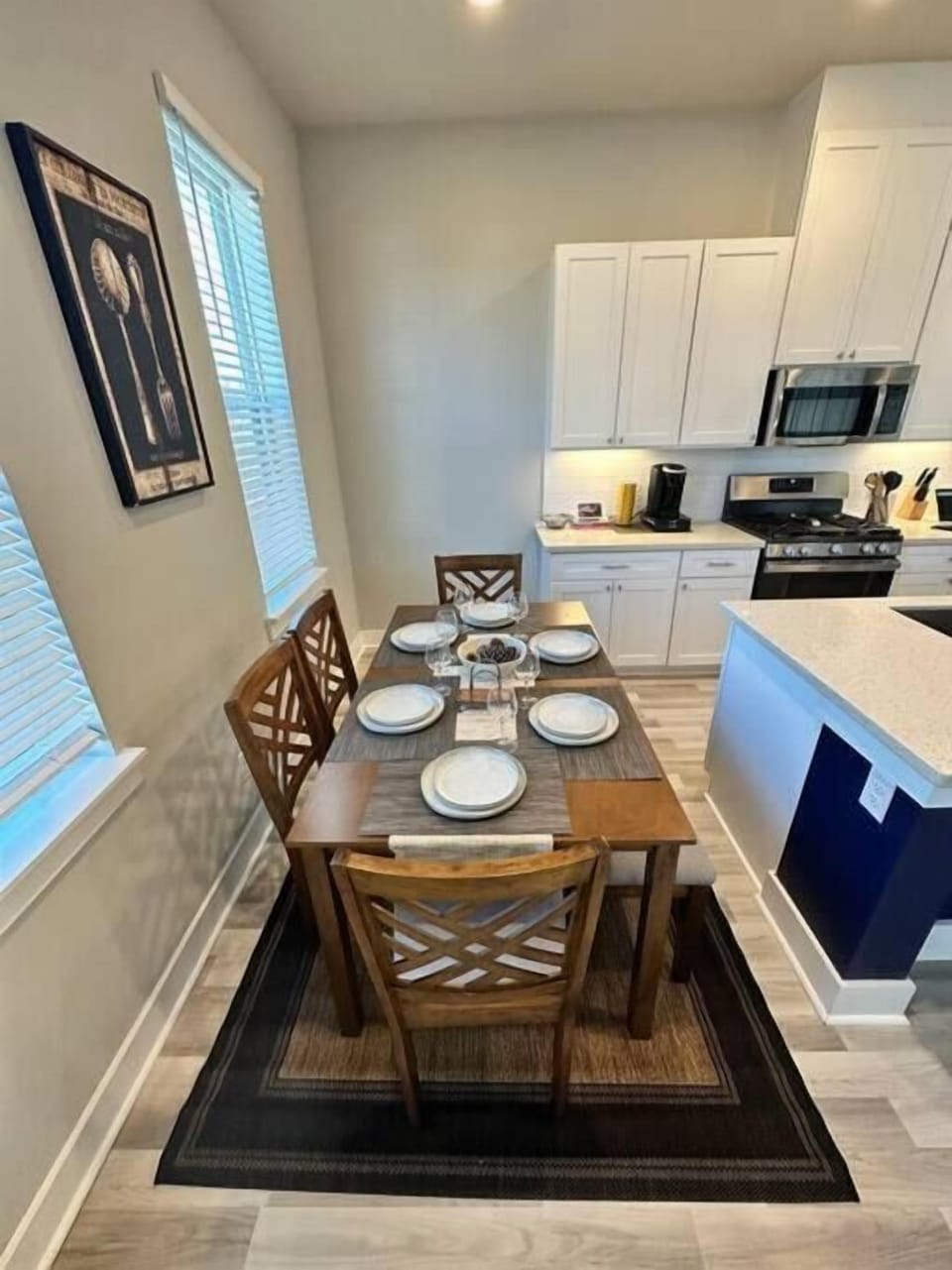 Modern dining space with seating for six, ideal for family meals or group gatherings.