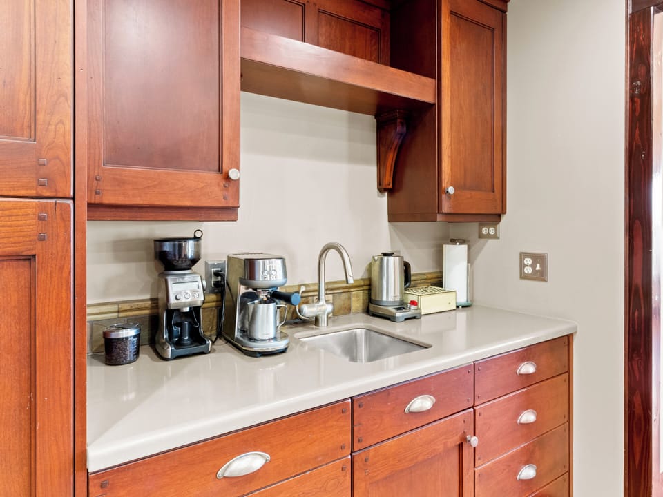 Fully stocked kitchen with espresso machine