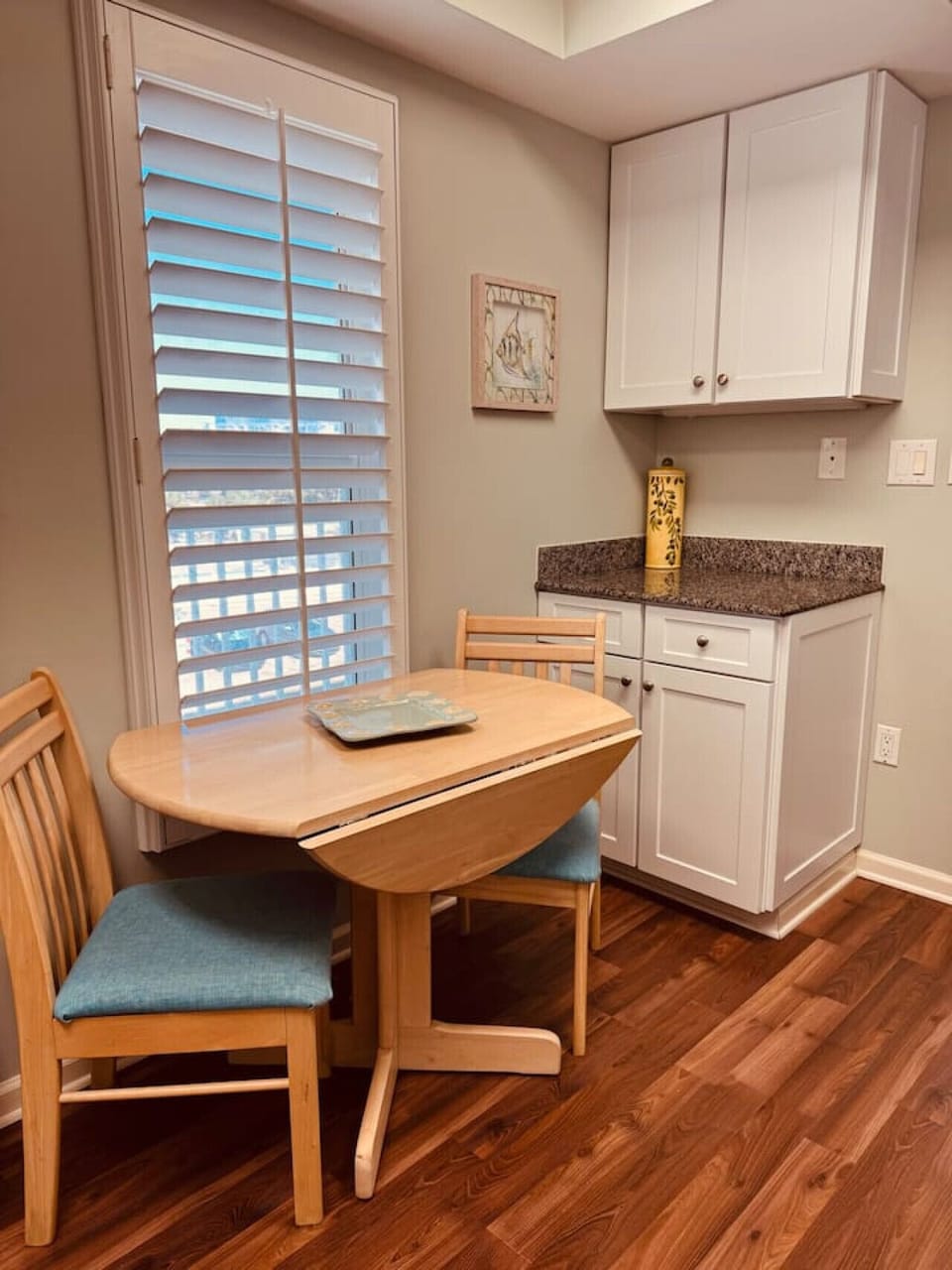 A cozy table for two in the kitchen, great for coffee or light meals.