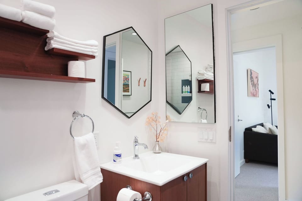 One of two fully updated modern bathrooms w. Ursa Major bath products.