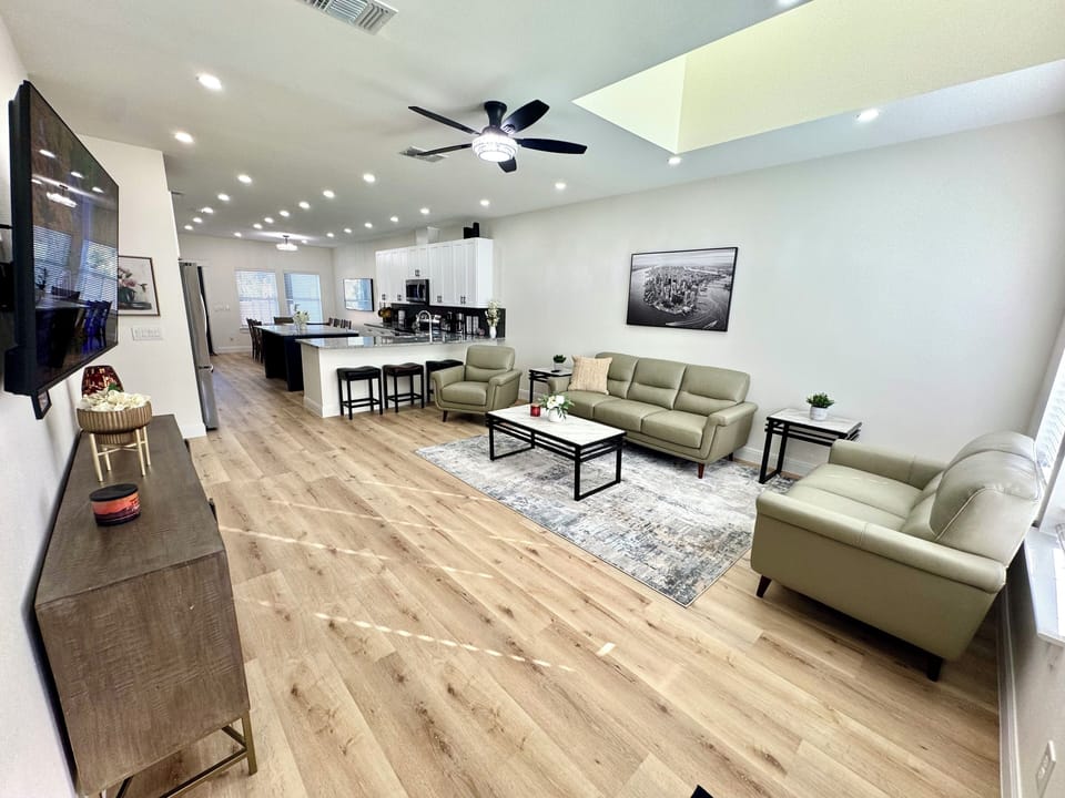 Livingroom , leather sofa , console 55 inch TV , coffee table and 2 end table