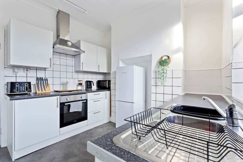 Enjoy the comfort of a home-cooked meal in this modern, fully equipped kitchen — perfect for long or short stays.