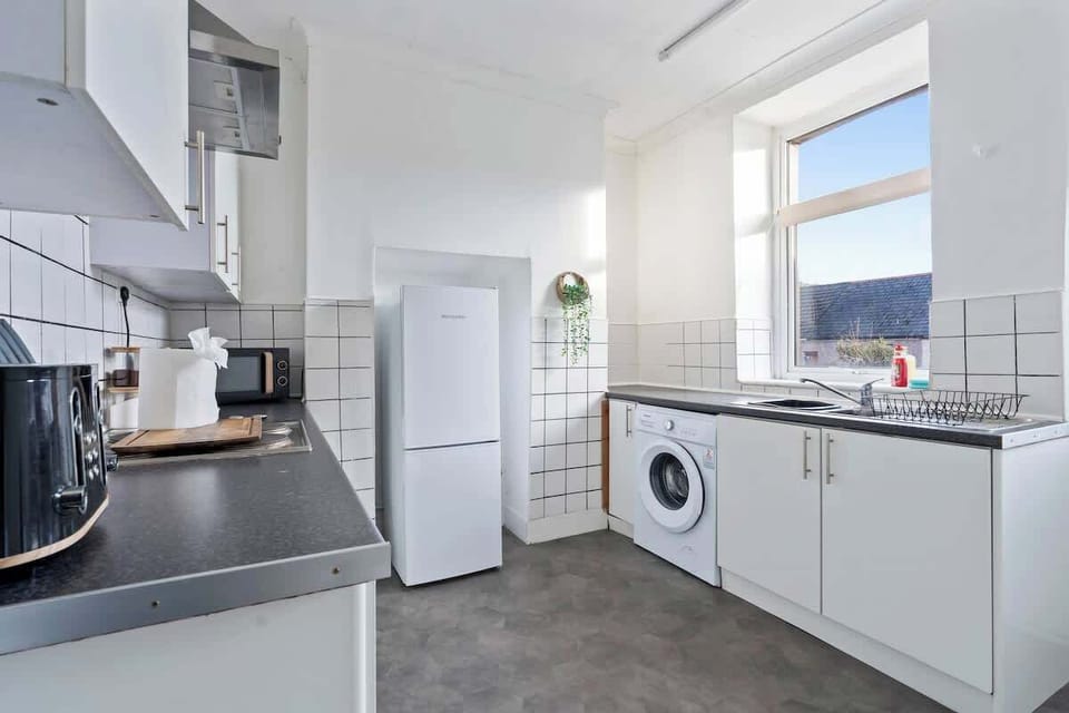 Cook your favourite meals in our fully equipped kitchen with modern appliances and plenty of natural light.
