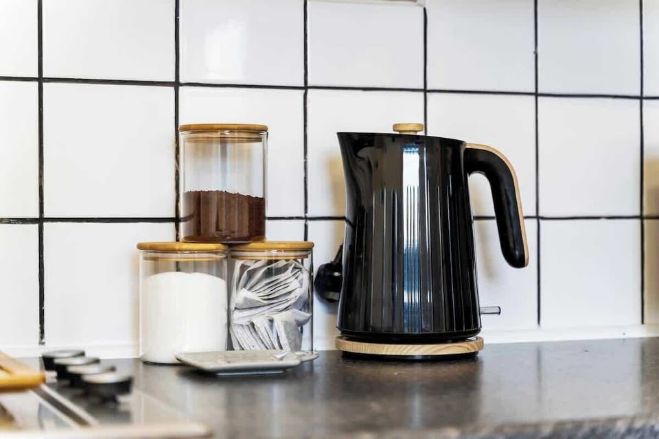 Everything you need for your stay — a sleek, fully equipped kitchen ready for your next meal.