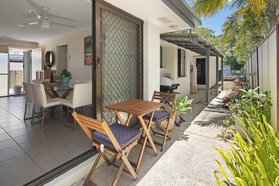 A relaxed alfresco nook just off the living space—ideal for morning coffee, casual meals, or unwinding in the shade while enjoying the fresh breeze.