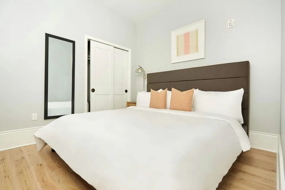 Bedroom 2 features a queen bed.