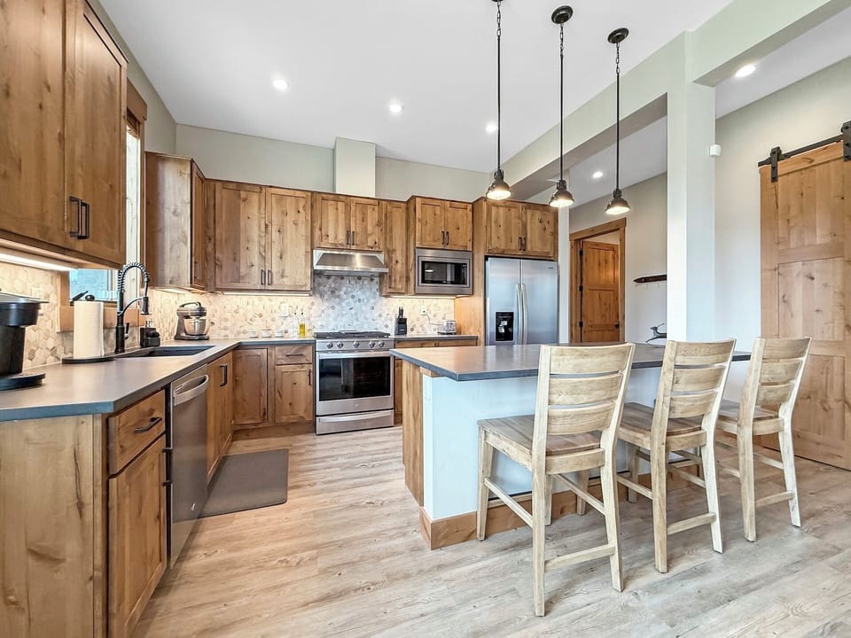 We have ample dining space at the table and island, plus a fully stocked kitchen