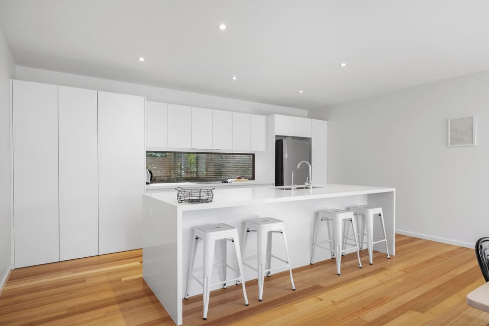 Clean, stylish kitchen ready for cooking