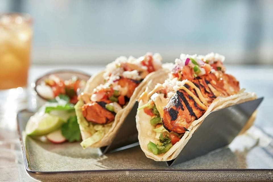 Grilled fish tacos topped with fresh salsa