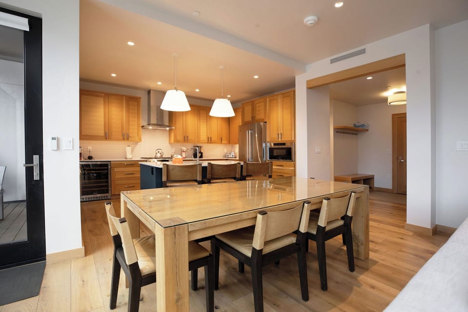 Enjoy meals together at the elegant dining table while taking in Colorado's mountain majesty