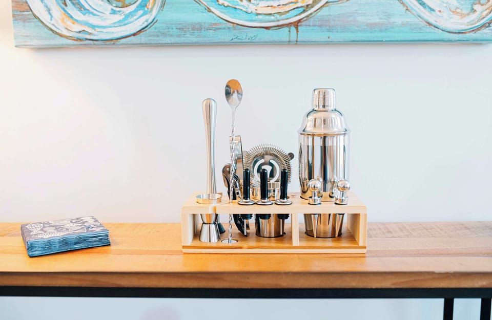 Evenings flow effortlessly with a charming bar cart—perfect for mixing a drink, unwinding after a day on the water, and enjoying quiet moments while the kids finish a game or settle in for the night.