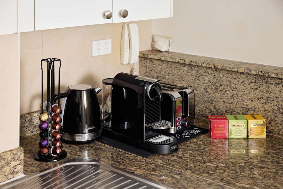 Coffee Station:
Premium morning ritual essentials featuring Nespresso machine, electric kettle, toaster, and curated Twinings tea selection. Everything you need to start each Sydney adventure perfectly caffeinated.