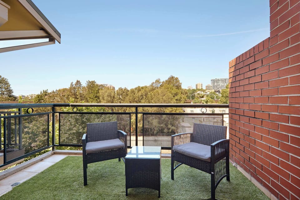 Private Balcony - exclusive use:
Inviting balcony retreat with comfortable outdoor seating and artificial turf. Enjoy leafy outlooks and city glimpses while relaxing in your own private outdoor oasis.