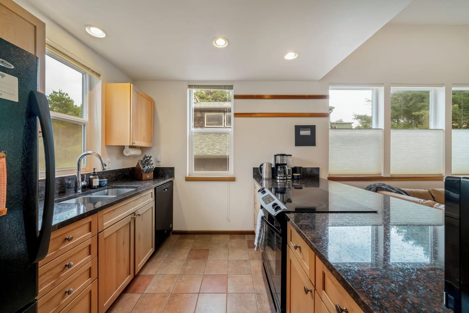 Kitchen is fully equipped with all appliances.