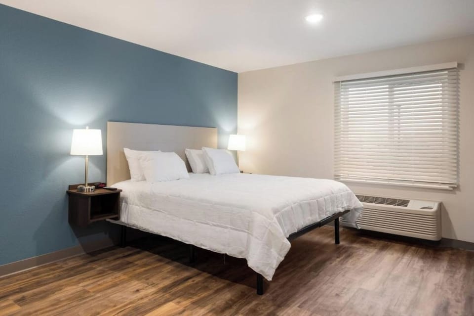 Unwind in crisp linens under warm lamplight, perfectly peaceful.