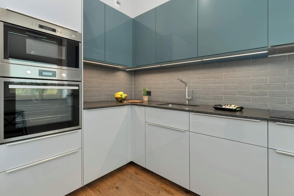 Modern kitchen with glossy cabinets and plenty of storage.