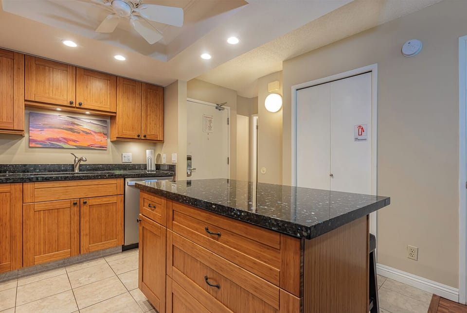 Large island offers extra counter space and a comfortable spot for casual dining