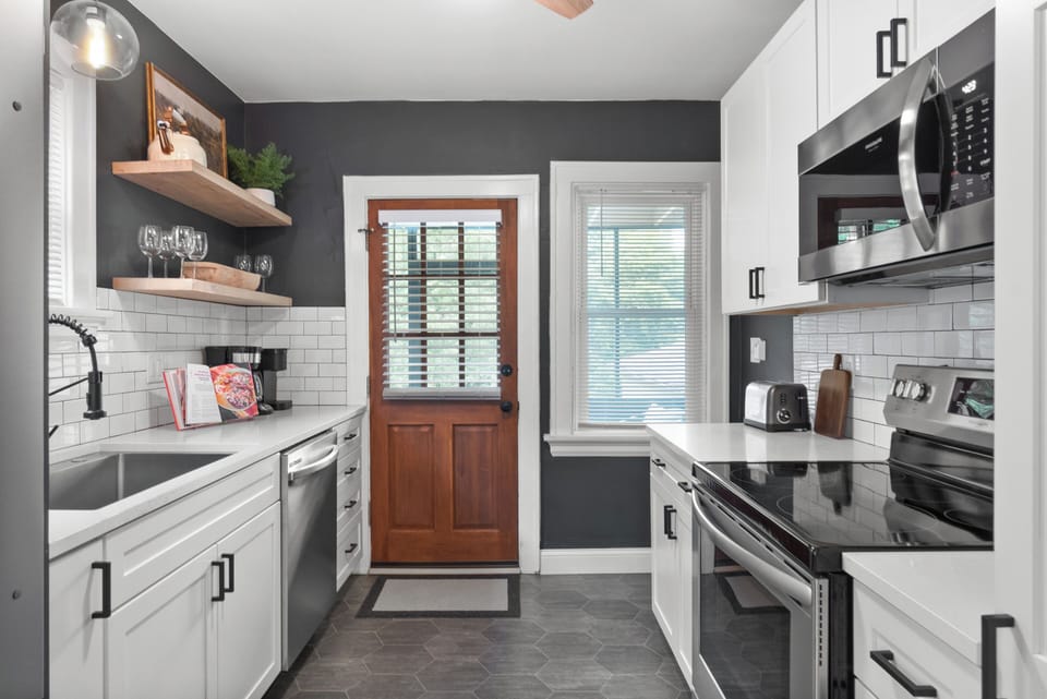 Kitchen with SS appliances, large sink, Keurig and traditional coffee maker.