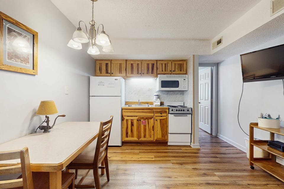 Kitchenette haven awaits. A bright space with rustic charm, perfect for cooking up your mountain adventures!