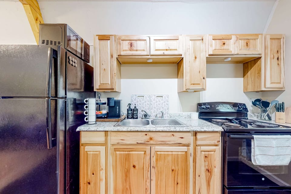 Enjoy cooking in a spacious kitchen with modern appliances and rustic charm!