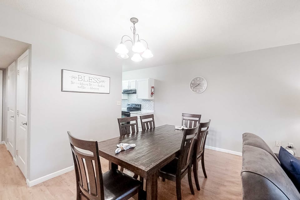 Gather around the spacious table for meals and memories in this inviting space!