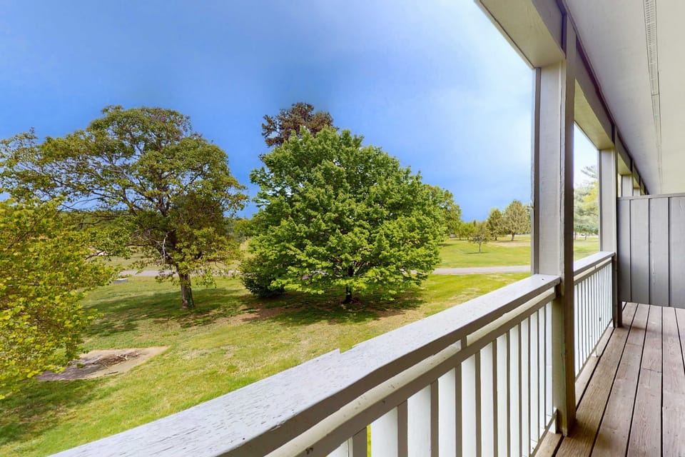 Private balcony with peaceful green views. Enjoy morning coffee and fresh air. Great for couples and weekend getaways. Outdoor space, scenic views, relaxing studio stay, nature vibes.