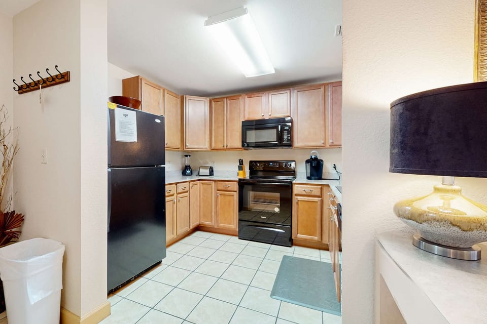 Whip up culinary delights in this modern kitchen with sleek appliances and ample space!