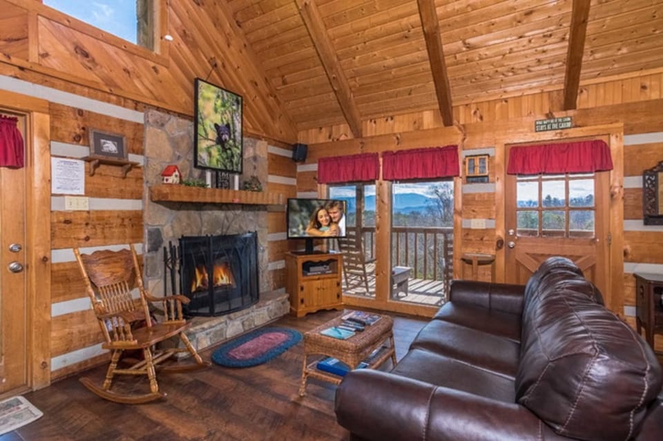 Enjoy breathtaking mountain views from this inviting space with a warm fireplace!