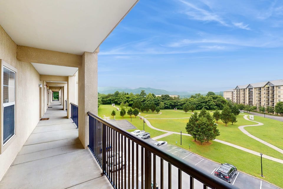 Balcony view awaits. And, sip coffee with stunning mountain vistas and lush, green parklands below!