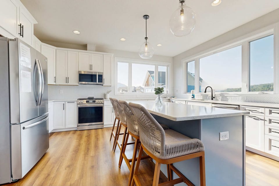 Stylish kitchen awaits. Bright interiors with modern appliances and stunning mountain views await you!
