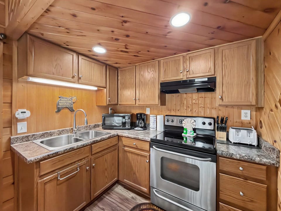 Kitchen, whip up culinary delights in a stylish, fully-equipped kitchen with rustic charm!