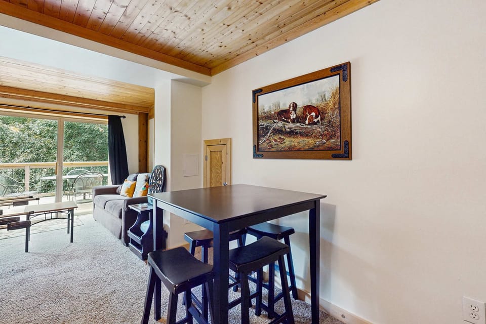 Spacious game room seating with high-top table. Great for snacks, board games, and family hangouts after hiking, Dollywood fun, or exploring Gatlinburg & Pigeon Forge in the Smoky Mountains.