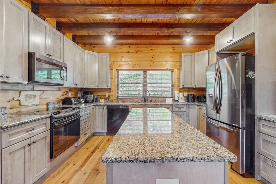 Whip up culinary delights in this modern, spacious kitchen with stunning granite countertops!