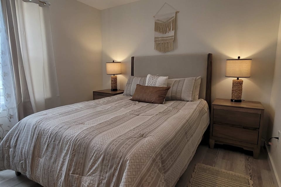 Bedroom Oasis, experience tranquility in a beautifully appointed room with stylish decor and warm light!