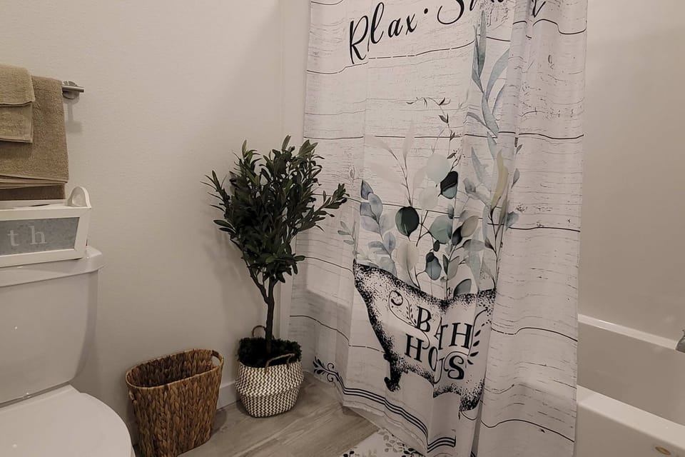 Bathroom Retreat, unwind with stylish decor and lush accents for a refreshing experience!