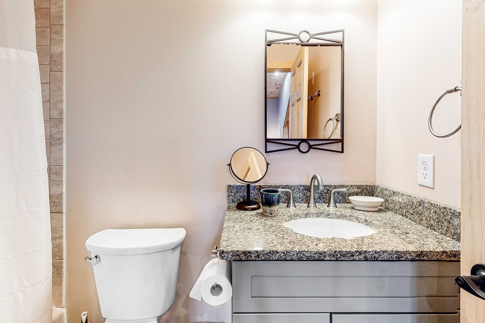 Stylish granite vanity and modern touches for a refreshing experience!