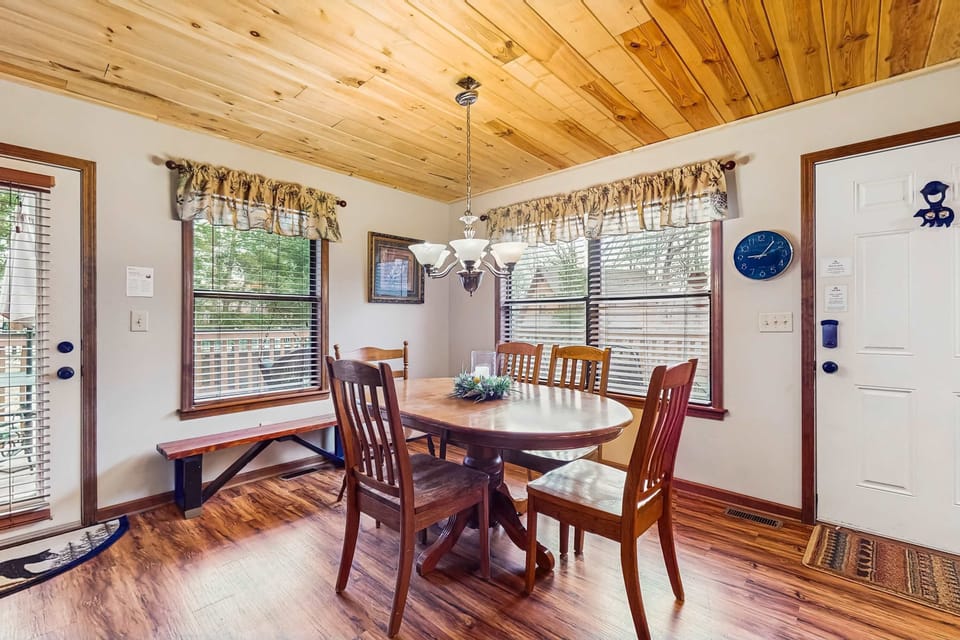 Gather around for meals with a view through sunny windows and charming wood accents!