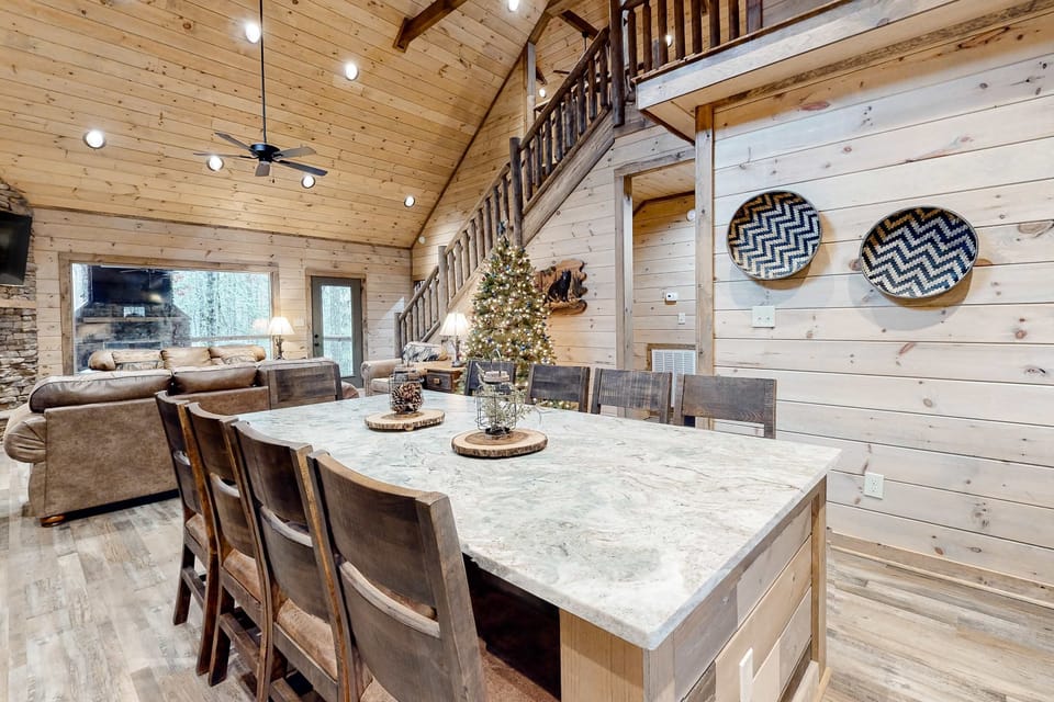 Large dining table with seating for the whole group—perfect for family meals, game nights, and celebrations in this spacious Smoky Mountain cabin near Gatlinburg.