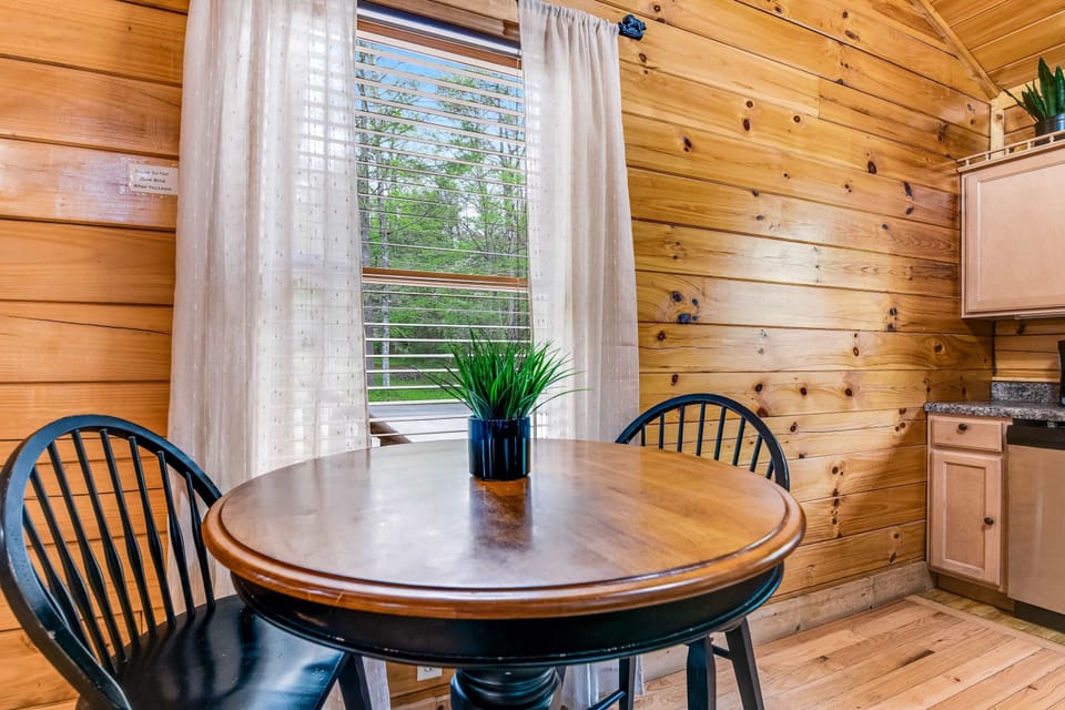 Enjoy meals with a view in this bright, inviting space filled with rustic charm!