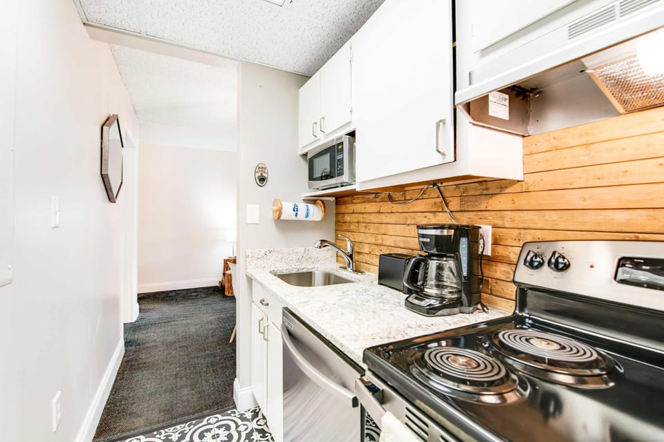 Dining area with seating for meals, games, or remote work. Ideal for couples, weekend getaways, or small family trips to Gatlinburg, Pigeon Forge, and the Smoky Mountains.