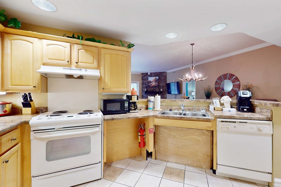 Whip up culinary delights in this bright, fully-equipped kitchen with charming decor!