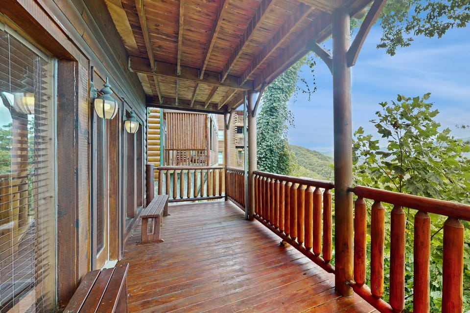 Enjoy breathtaking mountain views from this spacious wooden deck!