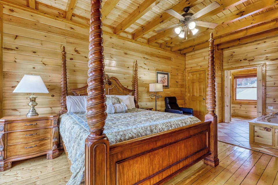 Indulge in a stylish escape with a luxurious four-poster bed and scenic views!