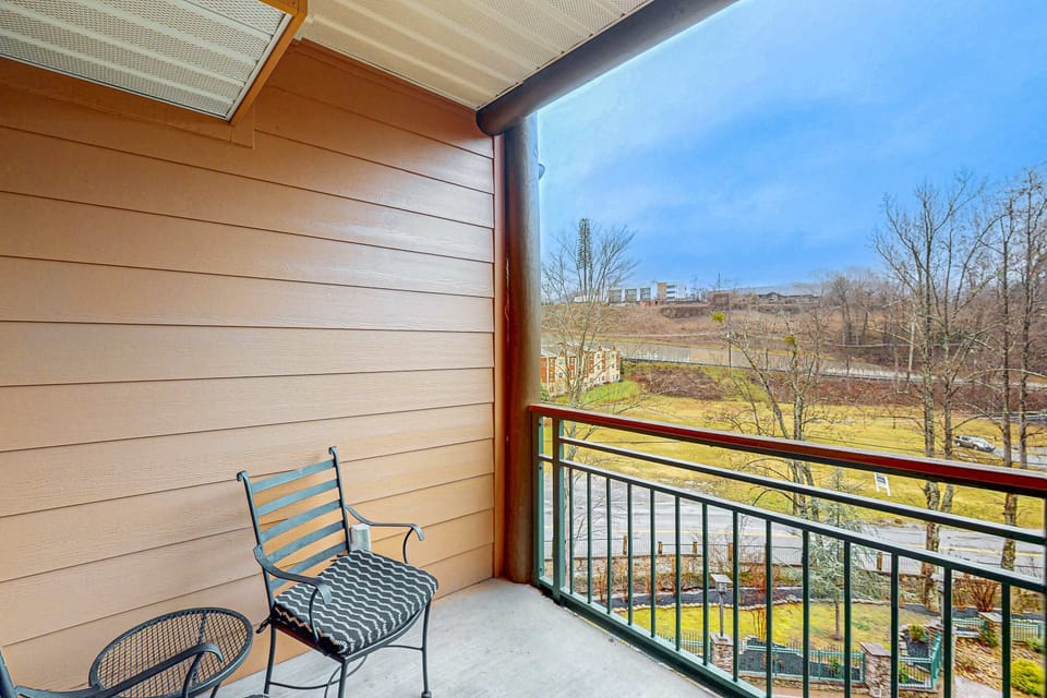 Sip coffee on the private balcony with serene mountain views and stylish seating!