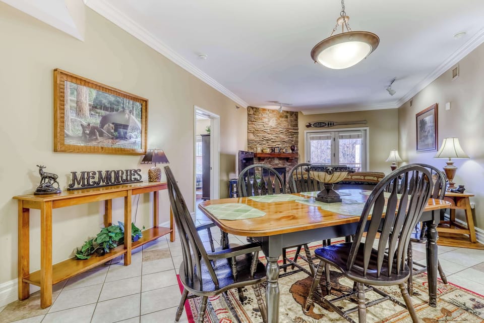 Gather around a beautiful wooden table beneath warm lighting for unforgettable meals!