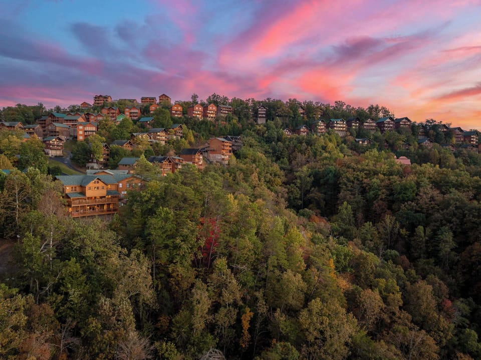 Breathtaking mountain views embraced by vibrant fall foliage and charming cabins!