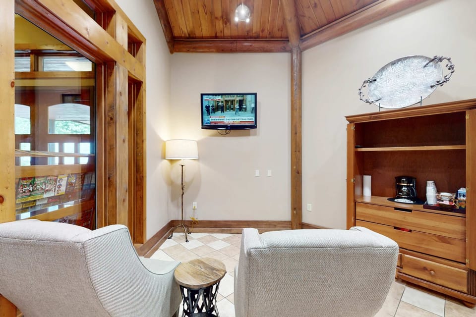 Relax in style with charming wood accents and a cozy seating area!